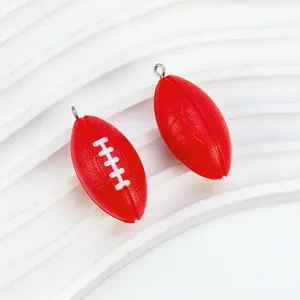 Mini red football charms for DIY jewelry making, sports fan souvenirs and cute hanging pendants.
