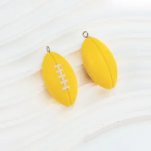 Mini yellow rugby ball pendant for DIY crafts, sports fans souvenir and keychain charm.
