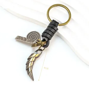 Vintage alloy wolf tooth keychain with leather wrap and creative horn pendant for keys.