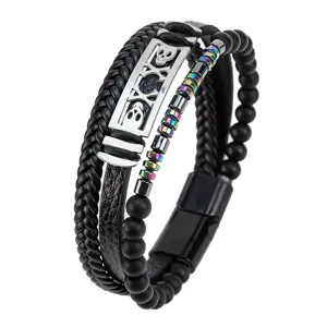 Close-up detail shot of a multi-layer punk leather bracelet with skull metal plaque and beads.