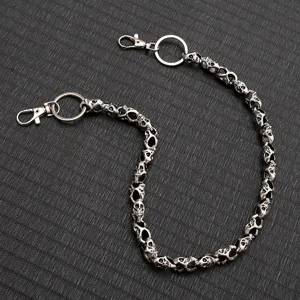 Detailed shot of retro punk skull metal wallet chain, gothic keychain and hip hop pants chain.
