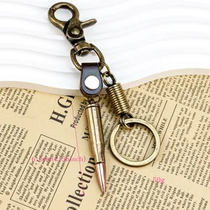 Vintage bullet keychain with metal lobster clasp and leather strap, compact and stylish.