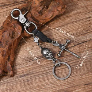 Vintage punk metal skull keychain with leather braid, dagger and cross charms for men.