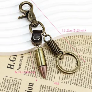 Detail shot of retro bronze bullet keychain pendant, metal keyring with lobster clasp.