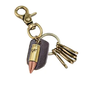 Vintage bullet keychain with leather tag and bronze metal hardware, trendy couple gift accessory.