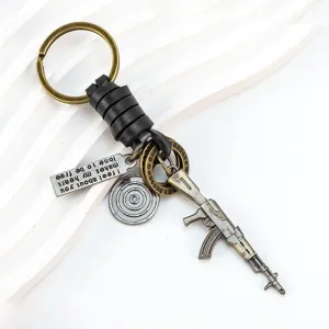 Creative rifle keychain with leather strap and alloy gun pendant for daily use and gifts.