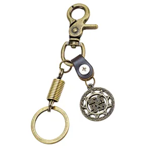 Llavero de aleación de bronce vintage con correa de cuero y colgante solar único.