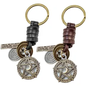Vintage leather braided keychain with pentagram moon pendant and retro metal tag charm.