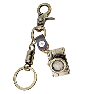 Llavero de cámara vintage de aleación de metal con colgante de cuerda de cuero chulo