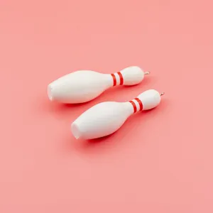 Mini bowling pin keychain pendant, white sports souvenir charm and cute accessory.