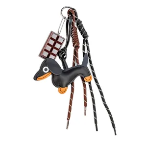 Close-up detail of the cute dachshund leather keychain with chocolate charm and braided ropes.