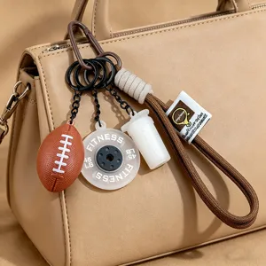 Cute football keychain sports bag charm, fitness barbell plate and water bottle design pendant.