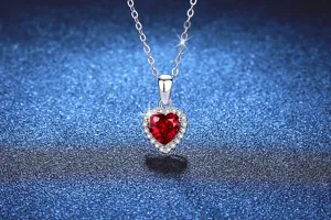 Close up of 925 sterling silver heart ruby necklace detail showcasing sparkling gemstone.