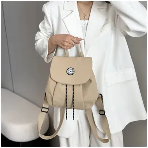 Mini sac à dos décontracté minimaliste coréen pour femmes, modèle uni léger et pratique.