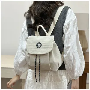 Petit sac à dos décontracté coréen pour femmes, léger, couleur unie, étanche, détail de voyage.