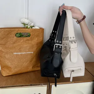Trendy PU leather shoulder baguette bag with chic metal buckle and front zip pocket design.