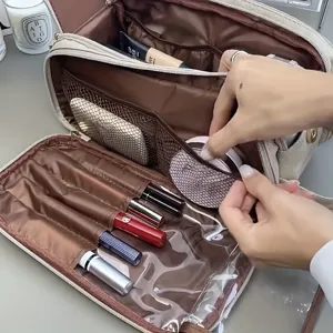 Large capacity cosmetic bag with multiple compartments, makeup brush slots, and clear pockets.