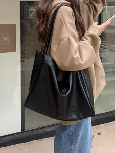 Soft leather tote bag for women, large capacity black shoulder bag, casual everyday handbag.