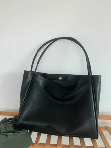 Detail view of the black soft leather slouchy tote bag, large capacity daily shoulder bag.