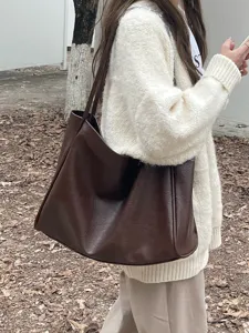 Brown soft leather tote bag detail view, casual large capacity shoulder bag for women.
