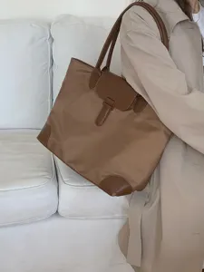 Large capacity nylon tote bag for women, commuter shoulder bag with leather trim details.