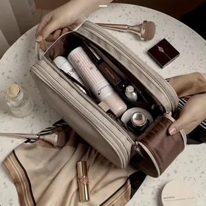Large capacity travel makeup bag with multi compartments for daily cosmetics and toiletries storage.