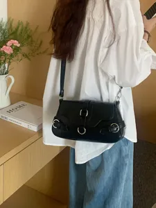 Black motorcycle style underarm shoulder bag for women, versatile PU leather crossbody bag.