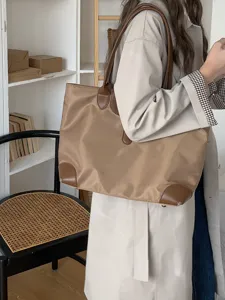 Large capacity nylon tote bag with leather handles, casual commuter shoulder bag for women.