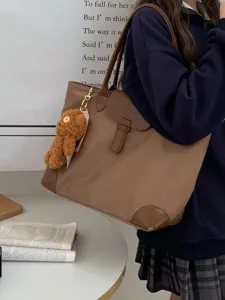 Large capacity nylon tote bag for women, stylish shoulder bag with cute bear pendant.