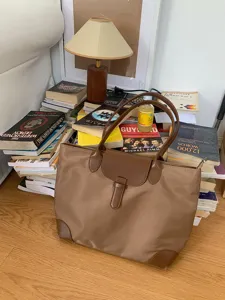 Large capacity brown nylon tote bag for women, stylish commuting handbag with leather flap.