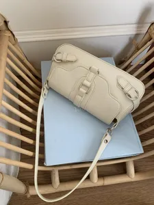 Chic cream white motorcycle style women shoulder bag with metallic buckle strap detail.
