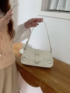 White PU leather shoulder bag for women, chic motorcycle style baguette bag with metal buckles.