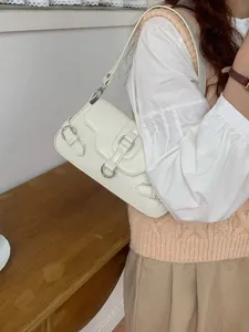White leather buckle shoulder bag detail, stylish Y2K underarm handbag for women daily wear.