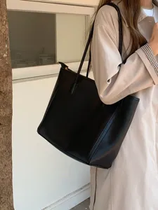 Classic black tote bag for women, large capacity stylish shoulder bag for daily commuting.