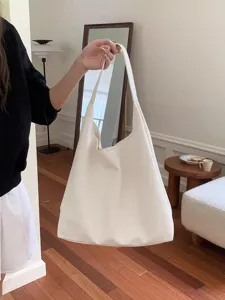 Minimalist white slouchy shoulder bag, large capacity casual hobo tote for daily commute.