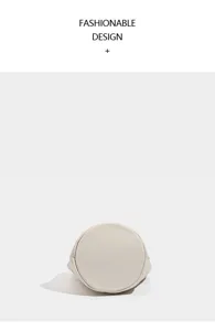 Minimalist solid beige leather bucket bag bottom detail view, premium soft leather.