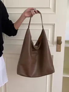Brown PU leather slouchy hobo bag detail shot, showing soft texture and large capacity daily carry.