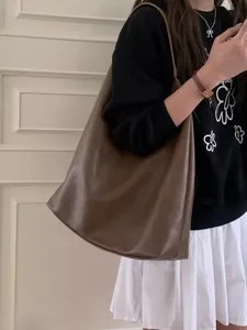 Detail view of the retro brown slouchy PU leather shoulder tote bag for women daily commuting style