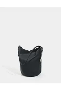 Detailed view of the black soft leather bucket bag with shoulder strap and silver chain.