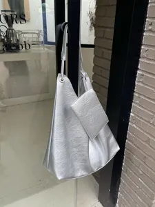 Silver metallic slouchy shoulder bag with small pouch, modern hobo tote for daily wear.