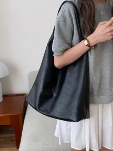 Black slouchy PU leather shoulder tote bag, large capacity casual daily commuter handbag for women.