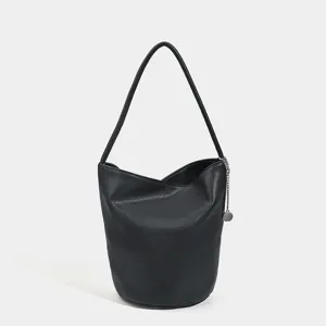 Stylish women black leather bucket bag, versatile shoulder handbag for daily commute.