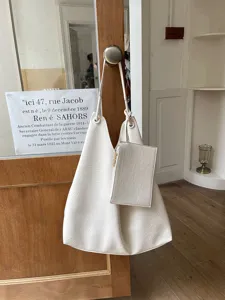 White casual tote shoulder bag with small pouch, stylish underarm bucket bag for daily use.