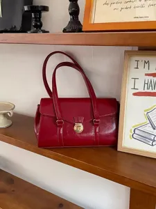 Red patent leather handbag for women, vintage top handle shoulder bag with lock closure.