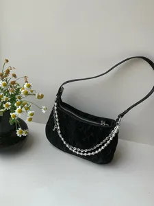 Black velvet shoulder bag with pearl and metal chain decoration, elegant baguette handbag for women.