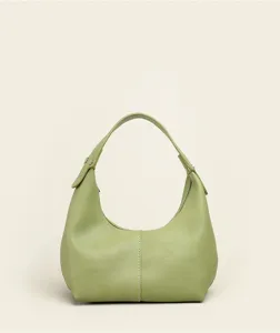 Detailed view of light green pebbled leather hobo bag with soft texture and short handle.