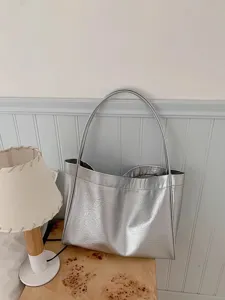 Silver metallic tote bag detail, spacious daily shoulder bag with shiny PU leather finish.