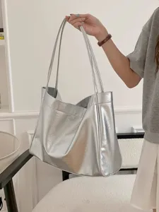 Silver metallic slouchy shoulder tote bag for women, spacious daily commuter handbag.
