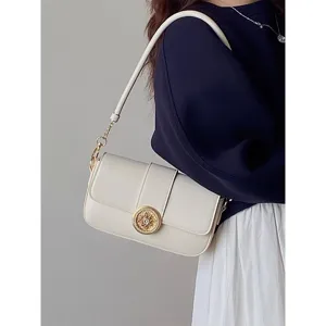 Detailed view of the chic retro white underarm shoulder bag featuring a golden clasp.