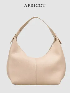 Stylish apricot PU leather hobo shoulder bag with pebble grain for women daily casual wear.